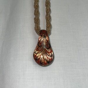 Art glass necklace on beaded braid strand. Lobster claw clasp
